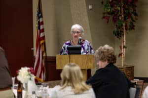 Servants of the Poor Banquet 10 Guest speaker addressing attendees from the podium at the 2026 Servants of the Poor Banquet