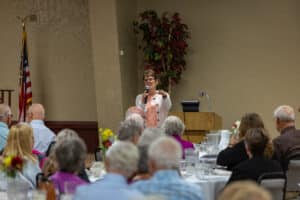Servants of the Poor Banquet 11 Speaker addressing seated guests during the 2026 Servants of the Poor Banquet