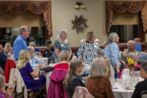 Servants of the Poor Banquet 4 Guests visiting around tables during the 2026 Servants of the Poor Banquet